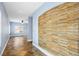 Inviting hallway featuring decorative stone wall and tiled flooring at 224 Devotion Ct, Henderson, NV 89052
