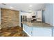Spacious kitchen featuring stone accents, modern appliances, and tile flooring at 224 Devotion Ct, Henderson, NV 89052