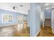 Bright living room boasting tiled floors, windows with shutters, and staircase at 224 Devotion Ct, Henderson, NV 89052