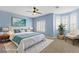 Staged bedroom showcasing a large bed, plantation shutters, and tranquil decor at 224 Devotion Ct, Henderson, NV 89052