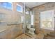 Tiled walk-in shower features glass enclosure and tiled window at 224 Devotion Ct, Henderson, NV 89052
