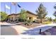 Exterior of the clubhouse featuring desert landscaping, sidewalks and covered entrance at 2539 Stardust Valley Dr, Henderson, NV 89044