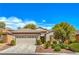Charming single-story home featuring a well-manicured front yard and a two-car garage at 2539 Stardust Valley Dr, Henderson, NV 89044