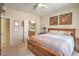 A spacious bedroom showcasing neutral colors and offering an attached bathroom entrance for convenience at 2539 Stardust Valley Dr, Henderson, NV 89044