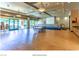 Versatile multi-purpose room featuring a stage, tables, chairs, and natural light from large windows at 2539 Stardust Valley Dr, Henderson, NV 89044