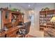Executive-style office featuring a built-in desk, bookcase, and plenty of natural light for enhanced productivity at 2539 Stardust Valley Dr, Henderson, NV 89044