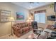 Cozy office space complete with a comfortable sofa and window, conducive for work or relaxation at 2539 Stardust Valley Dr, Henderson, NV 89044