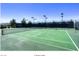 Well-lit tennis courts ready for a match at 2539 Stardust Valley Dr, Henderson, NV 89044