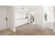 Inviting entryway with built-in cabinets, neutral flooring, and an open view to the kitchen at 2838 Geary Pl # 4002, Las Vegas, NV 89109