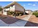 Exterior facade of a multi-Gathering building with a brick foundation and neutral-toned siding at 2838 Geary Pl # 4002, Las Vegas, NV 89109