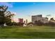 Golf course with lush green fairway, scattered trees, water sprinklers, and city views at 2838 Geary Pl # 4002, Las Vegas, NV 89109