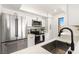Modern kitchen featuring stainless steel appliances, white cabinetry, and a stylish black faucet at 2838 Geary Pl # 4002, Las Vegas, NV 89109