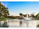 Scenic view of a pond and golf course with a beautiful building in the background at 2838 Geary Pl # 4002, Las Vegas, NV 89109