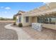 Backyard patio with a stone firepit and pergola, perfect for outdoor entertaining at 2999 Gettysburg Ave, Henderson, NV 89052