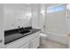 Neat bathroom with a black countertop sink and a shower with a bathtub at 2999 Gettysburg Ave, Henderson, NV 89052