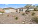Charming single-story home with low-maintenance desert landscaping, mature trees, and a convenient two-car garage at 2999 Gettysburg Ave, Henderson, NV 89052