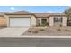 Charming single-story home features a well-maintained landscape, a two-car garage and a welcoming entrance at 2999 Gettysburg Ave, Henderson, NV 89052