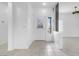 Bright foyer with tile flooring, decorative glass door, and modern architectural details at 2999 Gettysburg Ave, Henderson, NV 89052