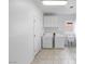 Practical laundry room equipped with washer, dryer, sink, and storage cabinets at 2999 Gettysburg Ave, Henderson, NV 89052