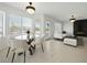 Bright, open living room with tile floors, modern lighting, and a sleek fireplace feature wall at 2999 Gettysburg Ave, Henderson, NV 89052