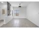 Bright living room featuring tiled flooring, decorative lighting, and entry door at 2999 Gettysburg Ave, Henderson, NV 89052