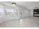Large living room featuring fireplace, tile floors, and multiple windows for natural light at 2999 Gettysburg Ave, Henderson, NV 89052