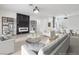 Bright, open-concept living room with a fireplace, tile flooring, and ample seating at 2999 Gettysburg Ave, Henderson, NV 89052