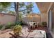 Backyard with tile patio, umbrella, and lush landscaping is perfect for relaxing or entertaining guests at 3380 Pavlo St, Las Vegas, NV 89121