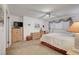 Bedroom features a four-poster bed, neutral carpet, and coordinating furniture at 3380 Pavlo St, Las Vegas, NV 89121