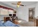 Bedroom featuring a desk and a ceiling fan, and view of the hallway at 3380 Pavlo St, Las Vegas, NV 89121