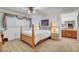 Bedroom features a four-poster bed and coordinating furniture with neutral carpeting at 3380 Pavlo St, Las Vegas, NV 89121
