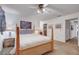 Bedroom features a four-poster bed and coordinating furniture with neutral carpeting at 3380 Pavlo St, Las Vegas, NV 89121