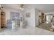 Open concept dining room area with tile flooring, leading to the living room at 3380 Pavlo St, Las Vegas, NV 89121