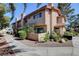 Charming townhome featuring a red tile roof, low-maintenance landscaping, and a cozy front patio at 3380 Pavlo St, Las Vegas, NV 89121