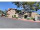 View of the home's exterior showcasing mature landscaping and architectural details under a clear blue sky at 3380 Pavlo St, Las Vegas, NV 89121