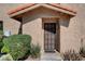 Inviting front entrance with a security door and manicured landscaping, offering privacy and curb appeal at 3380 Pavlo St, Las Vegas, NV 89121