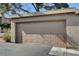 Close-up of a single-car garage featuring a beige door, providing secure parking at 3380 Pavlo St, Las Vegas, NV 89121