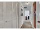 Hallway with a louvered closet door leading to other rooms at 3380 Pavlo St, Las Vegas, NV 89121