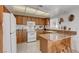Bright kitchen with granite countertops, bar seating, and tile flooring at 3380 Pavlo St, Las Vegas, NV 89121