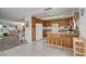 Bright kitchen with granite countertops, tile floors and a view of the living room at 3380 Pavlo St, Las Vegas, NV 89121