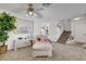Cozy living room area with neutral carpet, staircase and view of another room at 3380 Pavlo St, Las Vegas, NV 89121