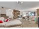 Inviting living space with a stone fireplace, carpeted floors, and access to outdoor views at 3380 Pavlo St, Las Vegas, NV 89121