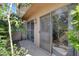 Charming patio with sliding glass door access is surrounded by lush tropical landscaping at 3380 Pavlo St, Las Vegas, NV 89121