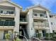 Condominium exterior showcasing a multi-story building with stairs and balconies with turquoise railings at 3550 Bay Sands Dr # 1005, Laughlin, NV 89029