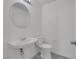 Bathroom features a white pedestal sink, toilet, and neutral wall color at 3644 Shanagolden St, Las Vegas, NV 89129
