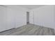 Bedroom featuring a closet, neutral paint and light gray wood-look flooring at 3644 Shanagolden St, Las Vegas, NV 89129