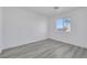 Bedroom showcasing natural light, neutral paint and light gray wood-look floors at 3644 Shanagolden St, Las Vegas, NV 89129