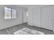 Bedroom with neutral paint, light gray wood-look floors, and closet at 3644 Shanagolden St, Las Vegas, NV 89129