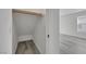 Walk-in closet with shelf and rod; wood-look floor extends to bedroom space visible through doorway at 3644 Shanagolden St, Las Vegas, NV 89129
