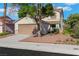 Charming two-story house with a well-maintained lawn and a two car garage, creating a welcoming curb appeal at 3644 Shanagolden St, Las Vegas, NV 89129